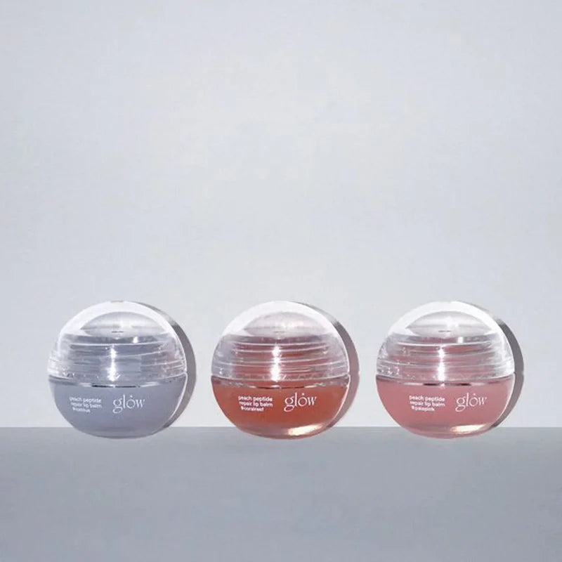 a group of round plastic containers with pink and grey liquid in them