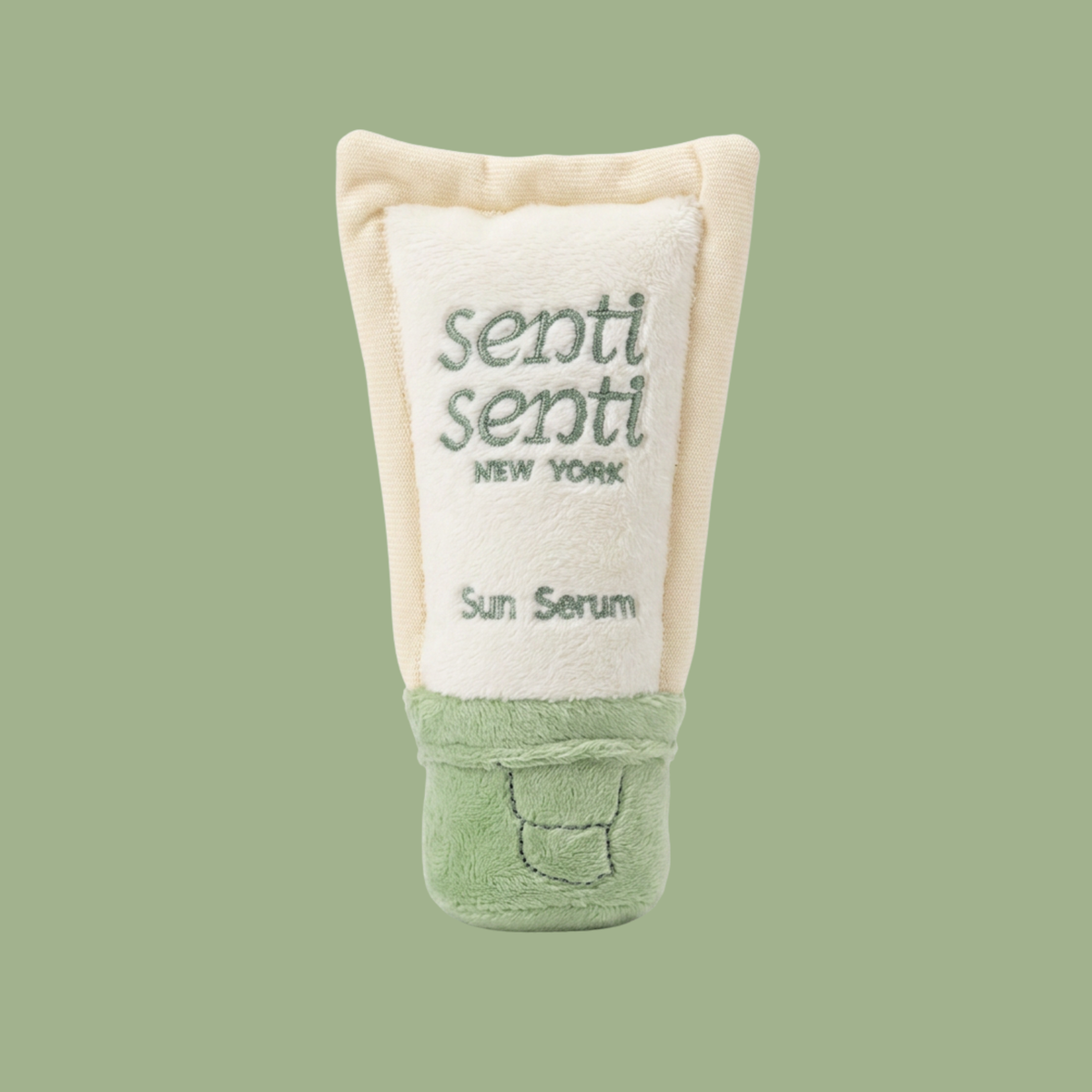Pawscreen SPF 50 plush dog toy, soft sun serum tube in cream and mint.