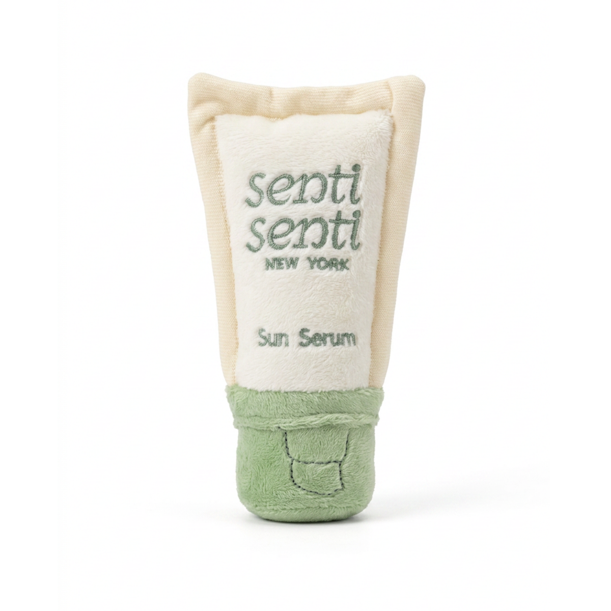Plush dog toy tube with beige top, green bottom, and "senti" logo
