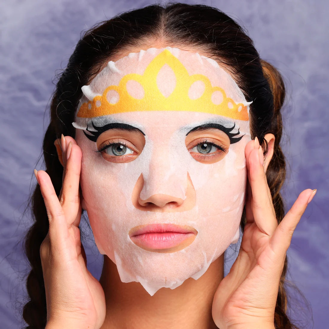 Halloween face sheet mask with gold crown graphic on face