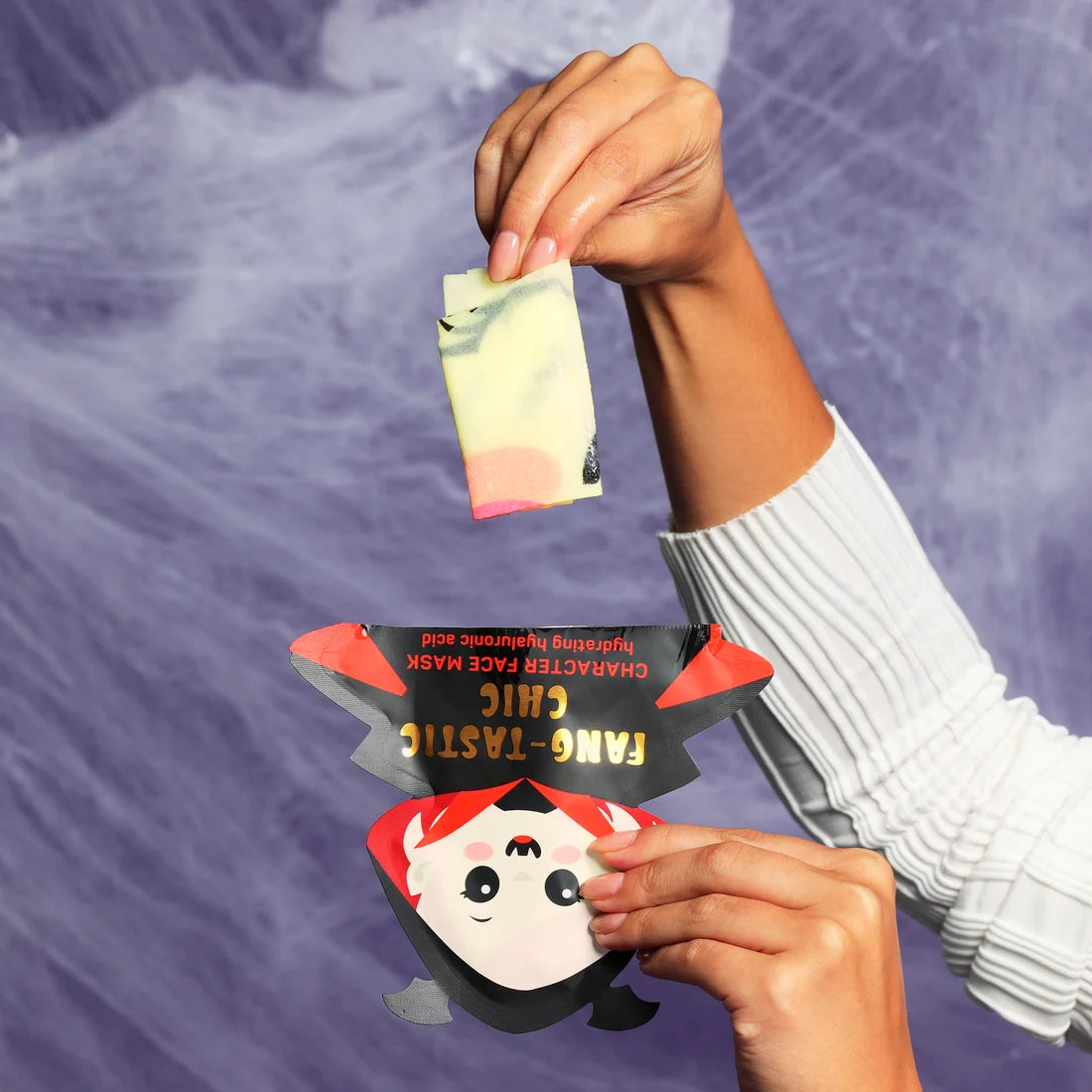 Fang-Tastic Chic character face mask sachet with catlike face design